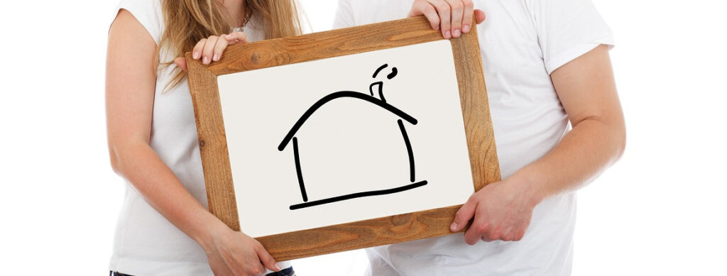 Immagine di un disegno di una casa su una lavagnetta